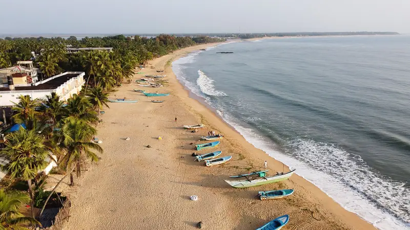 Arugam Bay beach and fishing boats seen from above