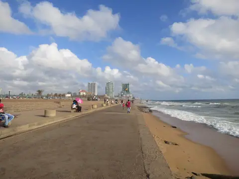 The Galle Face promenade and the Colombo skyline beside the Indian Ocean