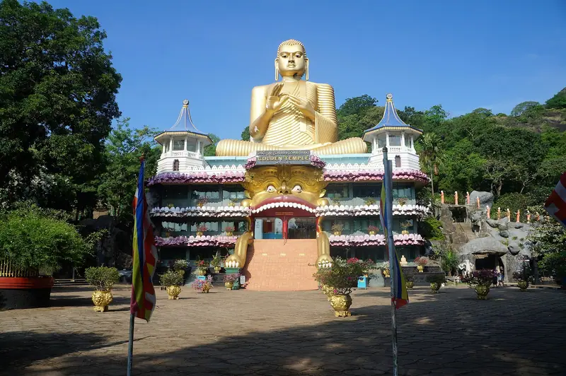 The Golden Temple and its giant gilded Buddha at the foot of the Dambulla rock