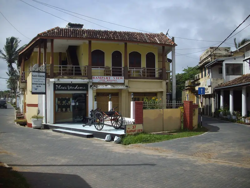 Old two-storey houses and shops on a street inside Galle Fort