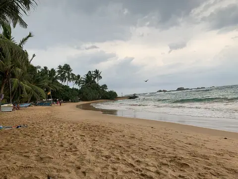 The long sandy beach at Hikkaduwa