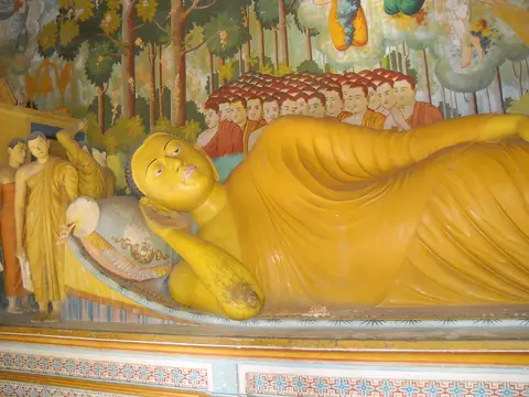A painted reclining Buddha inside Wewurukannala Vihara