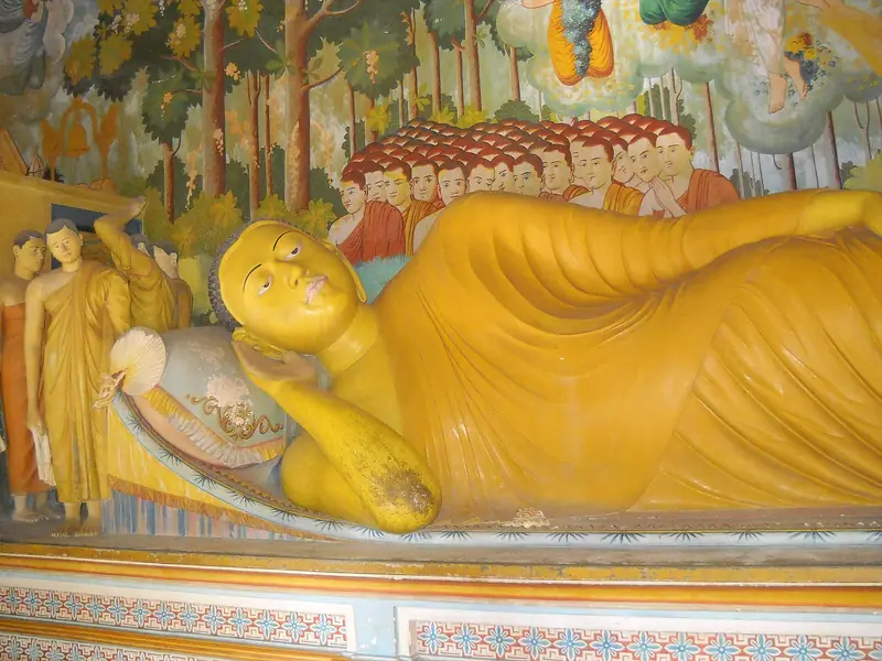 A painted reclining Buddha inside Wewurukannala Vihara