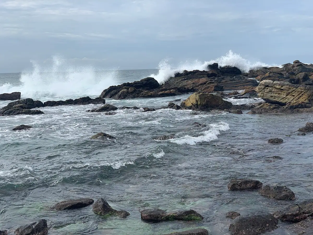 Waves breaking over the rocks on Dickwella beach, beside Hiriketiya