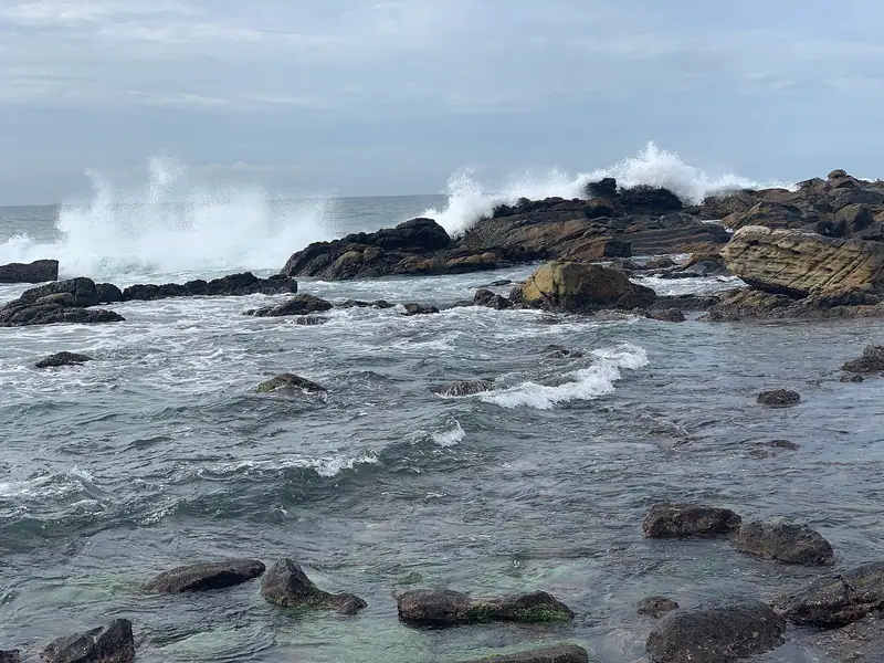 Waves breaking over the rocks on Dickwella beach, beside Hiriketiya