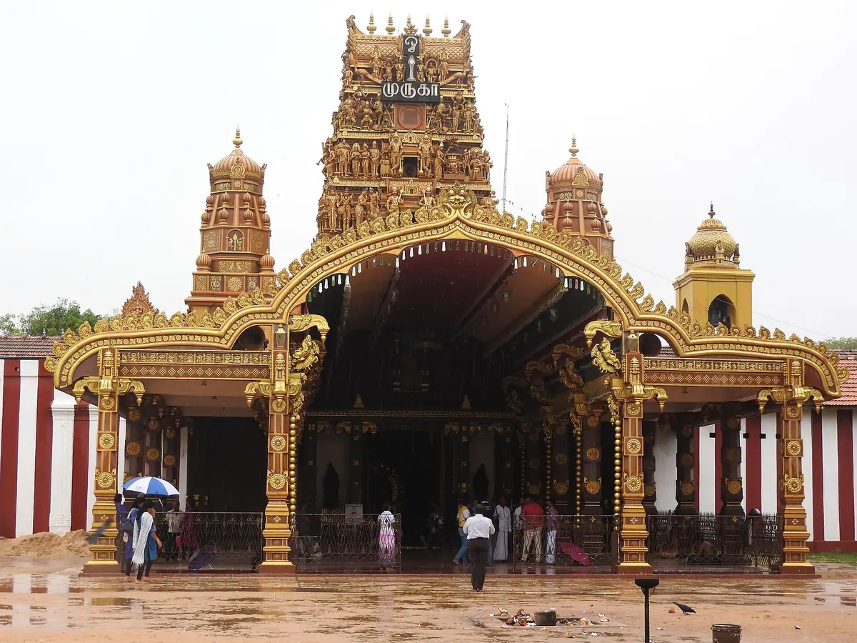 The golden gateway and red tower of Nallur Kandaswamy Kovil, Jaffna