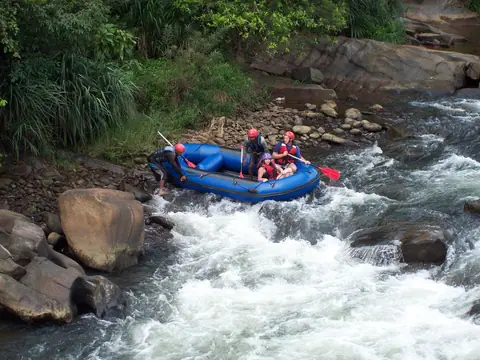 A raft running the rapids of the Kelani river near Kitulgala