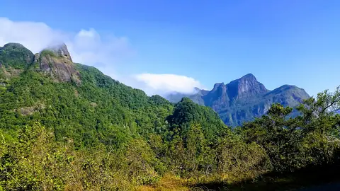 The jagged peaks of the Knuckles range under a blue sky