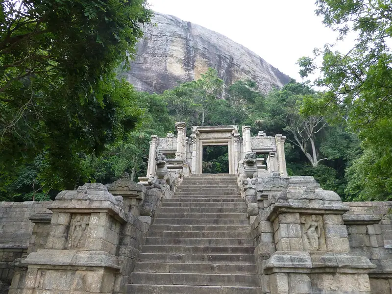 The carved stone staircase and gateway at Yapahuwa, climbing towards a granite rock