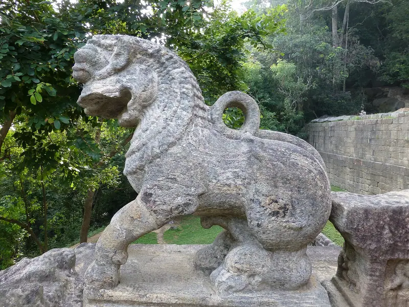 A stone lion guarding the stairs at Yapahuwa