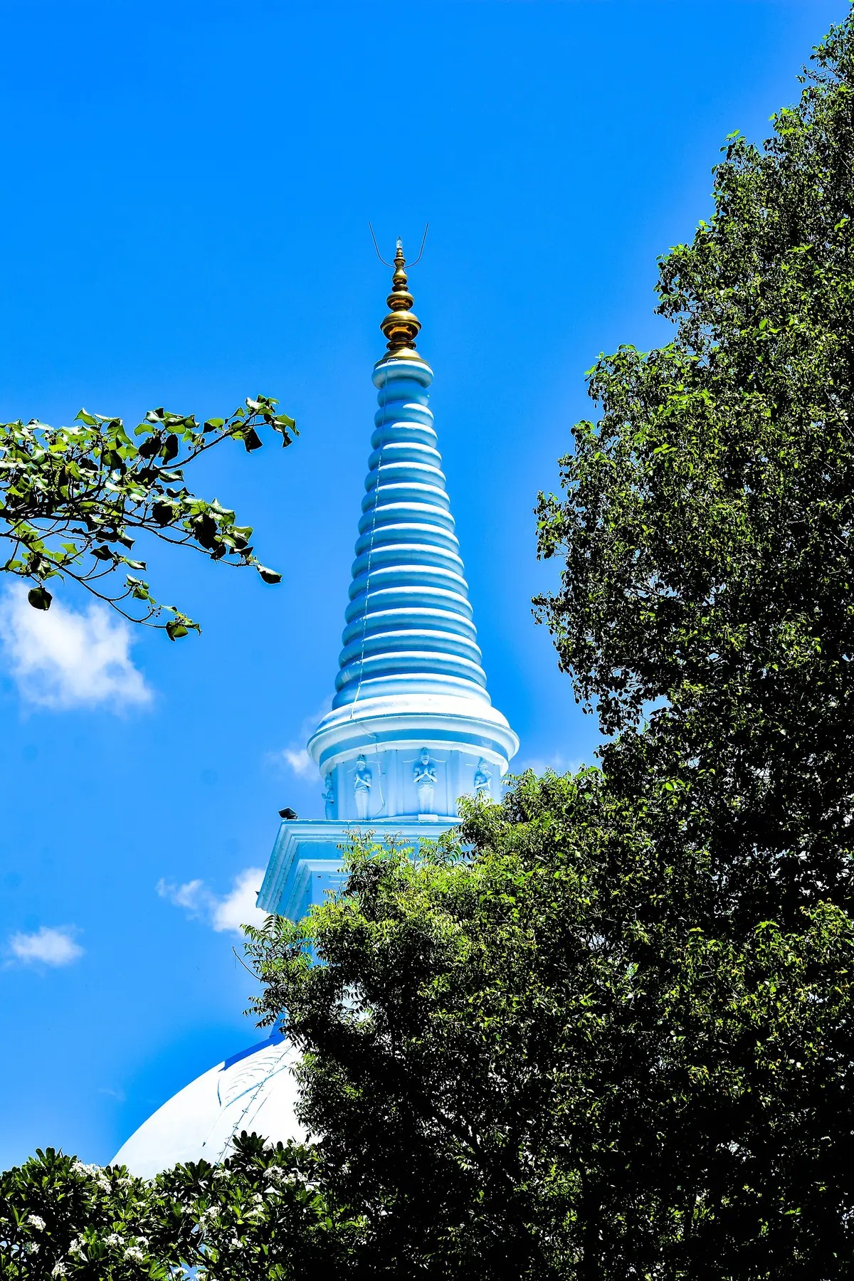 The stupa of Mahiyangana Raja Maha Vihara against the sky