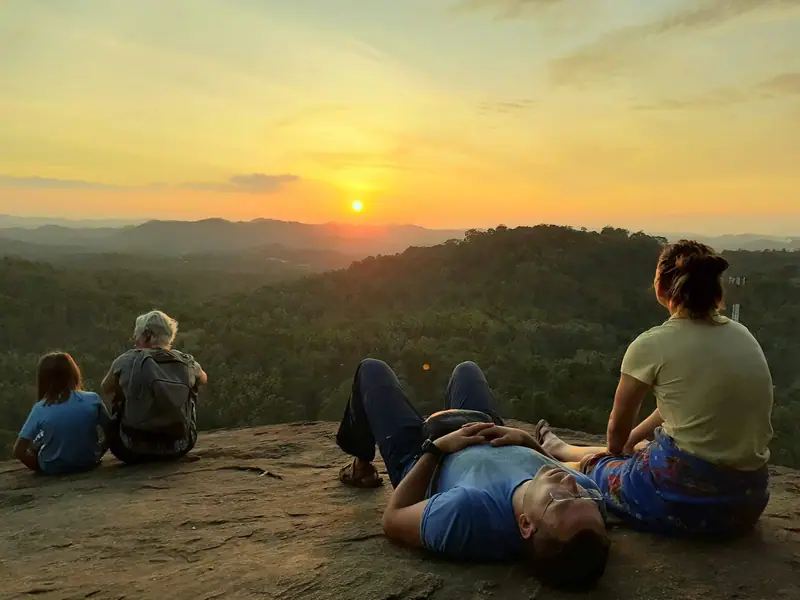Visitors watching the sunset from the top of Mulkirigala rock temple