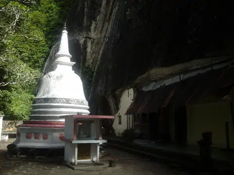 A white stupa under the rock at Mulkirigala temple