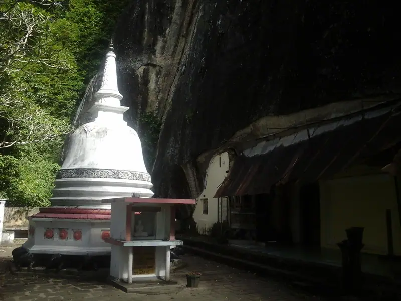 A white stupa under the rock at Mulkirigala temple