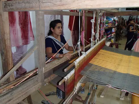 A weaver at a handloom in Sri Lanka