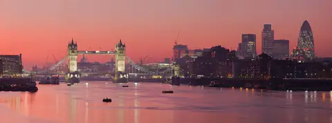 Tower Bridge and the City of London at sunset